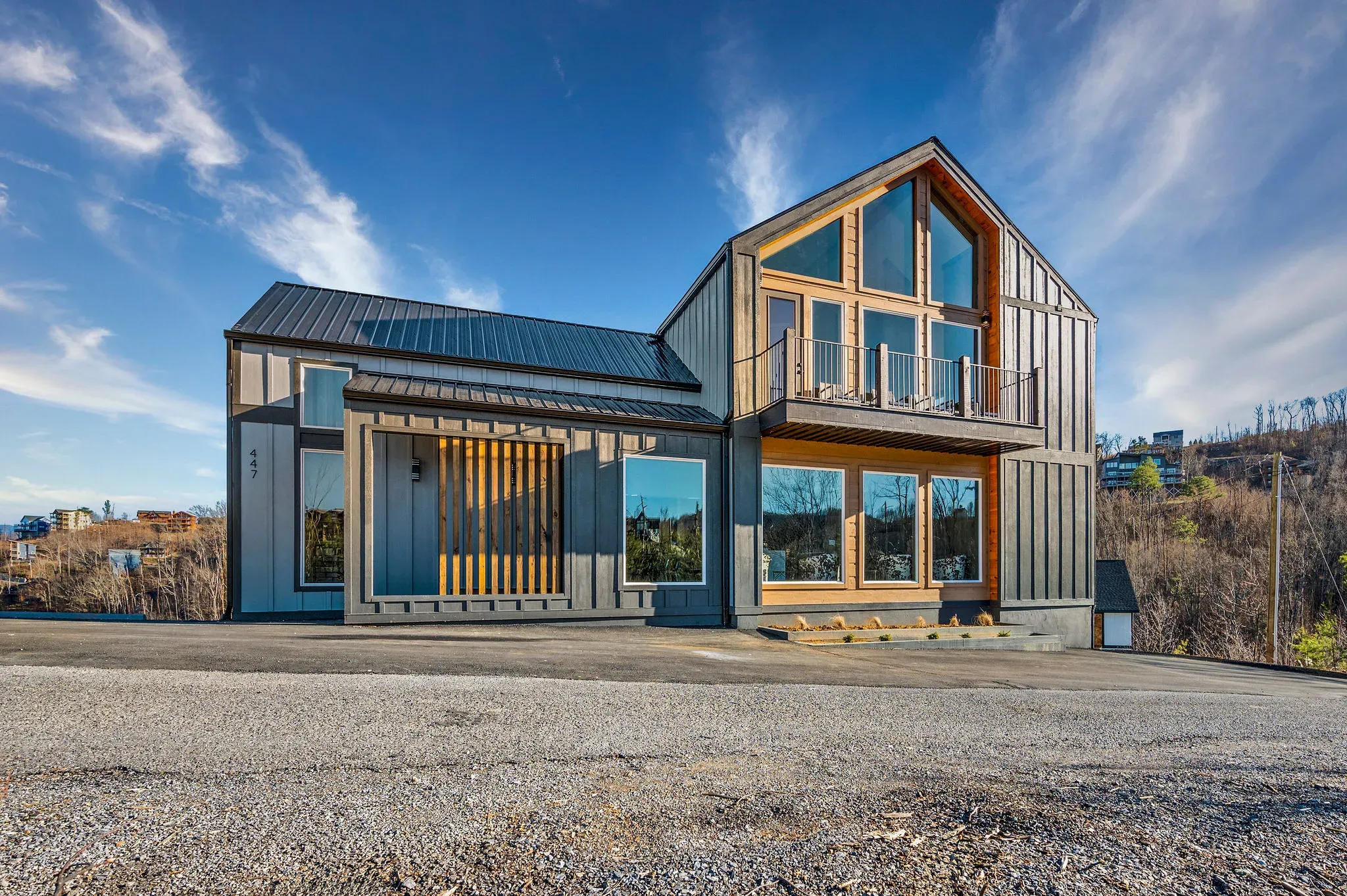 Contemporary mountain home with large windows, opening soon